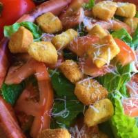 Caesar Salad · Romaine lettuce, tomato, and croutons. Served with Caesar dressing.