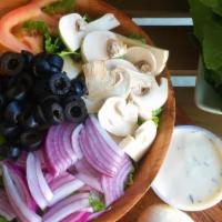 Garden Salad · Romaine lettuce, tomato, bell pepper, red onion, mushroom, and black olives. Served with ran...
