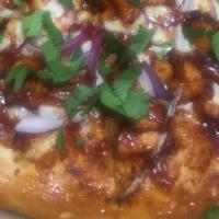 Bbq Chicken Specialty Pizza · Barbecue sauce base, barbecue chicken, red onion, and cilantro.