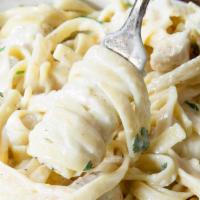 Chicken Fettuccine Alfredo · Fettuccine tossed with Alfredo sauce and grilled chicken. Topped with mozzarella cheese.