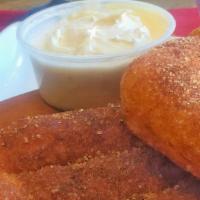 Cinnasticks · Fresh dough baked warm with butter and cinnamon sugar. Served with  cream cheese frosting.