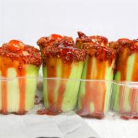 Crazy Cucumber · Fresh Cucumber, stuffed with peanuts and tamarind candy, topped with chamoy, tajin, lime and...
