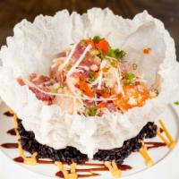 Ocean Blossom · Spicy crunchy assortment of fish in a crispy rice paper bowl served on a bed of black rice, ...