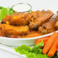 Buffalo Wings · Our own hot-n-spicy chicken wings & drummettes served with celery and carrot sticks with ran...