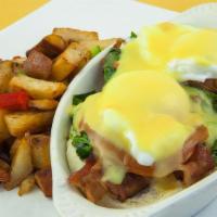 Egg Florentine · Large poached eggs atop bacon, fresh spinach and grilled tomatoes on a toasted English muffi...