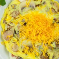 Country Skillet · Apple honey pork sausage, scrambled eggs, mushrooms, onions, and Cheddar cheese atop country...