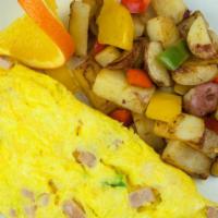 Denver Omelette · A hearty omelette of ham, fresh bell peppers and onions.