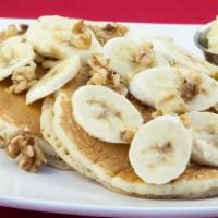 Banana Nut Pancake · Three buttermilk pancakes, topped with fresh chopped bananas and walnuts