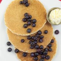 Blueberry Pancake · Three buttermilk pancakes, topped with fresh blueberries