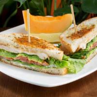 Newporter Sandwich · Broiled chicken breast, Swiss cheese, avocado, lettuce and tomatoes and rosemary aioli on gr...