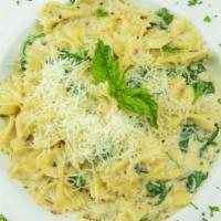 Pasta Florentine · Light cream sauce with fresh basil, garlic, spinach and parmesan cheese over bowtie pasta.