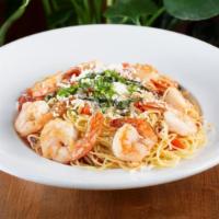 Shrimp Scampi · Sautéed shrimp, tomatoes, fresh basil, spices and garlic butter sauce over angel hair pasta....