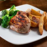 Pork Chop · Grilled prime center-cut bone-in pork chop. Served with two sides and garlic bread