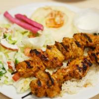 #2. Chicken Kabab · Two grilled chicken skewers, marinated with garlic and herbs. Served with rice, hummus, sala...