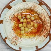 #26 Hummus Side · Garbanzo bean blended with fresh garlic, lemon juice and tahini drizzled with extra virgin o...