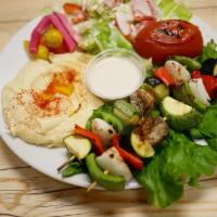 #11Veggie Grill · Two grilled skewers of a fresh seasonal vegetables served with hummus, salad, grilled tomato...