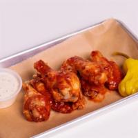 #32Hot Wings · 12 pieces of freshly deep-fried chicken wings mixed with special hot sauce served with ranch...