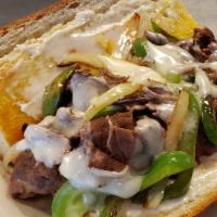 Philly Cheese Steak Sandwich · Philly mix of steak, sautéed bell pepper, and onions, on a steak roll with mayonnaise, toppe...