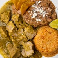Chile Verde Combo · pork chop slices cover in salsa verde served w/ rice beans and tortillas
