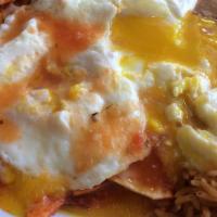 Chilaquiles · Eggs with beans, rice, cheese, sour cream, and avocado.