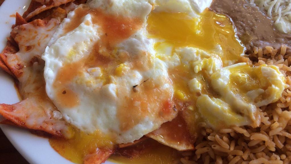 Chilaquiles · Eggs with beans, rice, cheese, sour cream, and avocado.