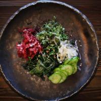 Mixed Seaweed Salad · Black wakame seaweed, green ogo thin seaweed and red tosaka seaweed with thinly sliced cucum...