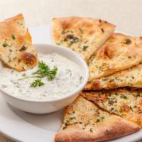 Warm Spinach & Artichoke Dip · Spinach, artichokes, garlic, and cheese, served with fresh baked pizza bread.