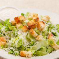 Caesar Salad · Romaine, garlic croutons, Parmesan cheese tossed with our Caesar dressing. Served with garli...