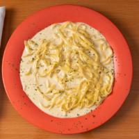 Fettuccini Alfredo · with creamy parmesan cheese sauce
