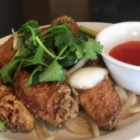 Fried Chicken Wings  (Cánh Gà Chiên Bạ) · Deep fried chicken wings tossed in butter