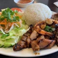 Combination Cơm -   (Cơm Thit Đậc Biet) · Grilled chicken, BBQ pork, onion wrapped beef & shrimp