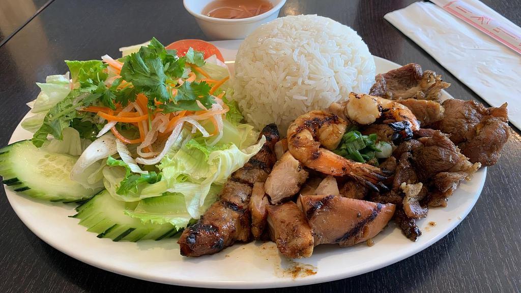 Combination Cơm -   (Cơm Thit Đậc Biet) · Grilled chicken, BBQ pork, onion wrapped beef & shrimp