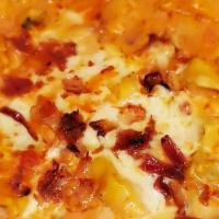 Tortellini · Sausage, beef, creamy rose sauce, topped with mozzarella and bacon