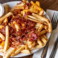 Cheesy Fries · Fries with melted mozzarella and Cheddar cheese topped with bacon. Served with ranch sauce.