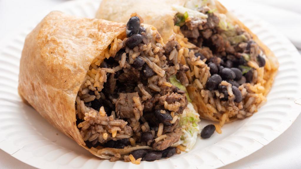 Pastor Burrito · Pork marinated in adobo grilled with onion and pineapple wrapped in a flour tortilla. Stuffed with black beans, rice, lettuce, sour cream, and queso fresco.