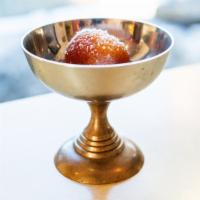 Gulab Jamun · Delicious golden brown pastry balls in a sugar syrup with a touch of rose water and green ca...