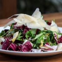 Tri-Color Salad · Baby wild arugula, Belgian endive and radicchio topped with shaved Parmesan and balsamic vin...