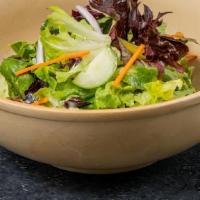 Mixed Greens Salad · Field greens, cucumber, shaved carrots, red onion, oregano vinaigrette.