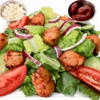 Spicy Chicken Greek Salad · White meat spicy chicken chopped and placed on top of romaine, iceberg lettuce, tomato, onio...