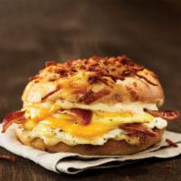 Farmhouse Egg Sandwich · Cheesy Hash Brown Gourmet Bagel with bacon, ham, cheddar cheese, and a country pepper shmear.