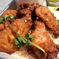 Wings 'N Rice Plate · Fried chicken wings served with white rice, choice of house made sauce and spicy cucumber sa...