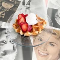 Mini Caramelized Belgian Waffle · Topped with fresh strawberries, whipped cream & dusted with powdered sugar.