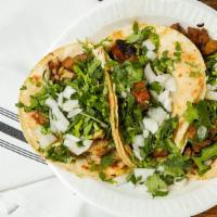 Tacos · your choice of steak, chicken, al pastor, carnitas, or birria. 
topped with fresh cilantro, ...