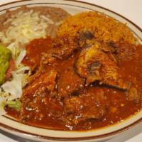 Chile Colorado · Pieces of pork cooked with mild red sauce. Served with rice, beans, guacamole, and tortillas.