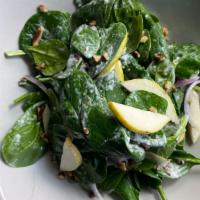 Insalata Spinaci · Baby spinach, fresh pears, caramelized pecans, red onions, and home-made gorgonzola dressing.