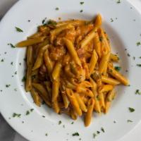 Penne Alla Boscaiola · Porcini mushrooms, pancetta and pink sauce, with penne pasta.