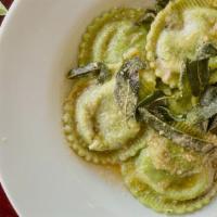 Ravioli Di Spinaci · Roasted garlic, spinach, ricotta ravioli, crispy sage, and butter.