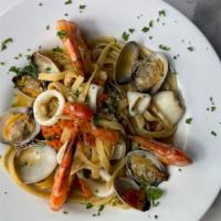 Fettuccine Pescatore · Fettuccine pasta with clams, shrimp, calamari, cherry tomato in a light olive oil garlic sau...