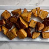 Patate Arrosto · Red potatoes roasted, fresh herbs and garlic.