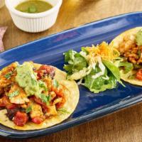 Salmon Tacos (Gluten-Free) · Scottish salmon, onions, tomato, jalapeños, cilantro, salsa verde, corn tortilla, guacamole,...